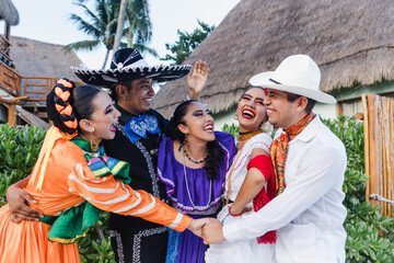 group of mexican dancers wearing traditional folk costume, young latin people portrait in Mexico...