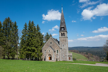Fototapeta na wymiar Picturesque Neo-Romanesque church in Zieleniec Duszniki Zdroj in the Orlickie Mountains, Poland
