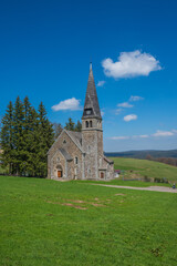 Fototapeta na wymiar Picturesque Neo-Romanesque church in Zieleniec Duszniki Zdroj in the Orlickie Mountains, Poland