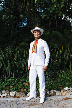 Latin man wearing traditional Mexican custom called "jarocho" traditional from Veracruz Mexico Latin America, young hispanic people in independence day or cinco de mayo parade or cultural Festival