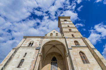 Fototapeta na wymiar Facade of Cathedral of St Michael in Alba Carolina Citadel, Alba Iulia city, Romania