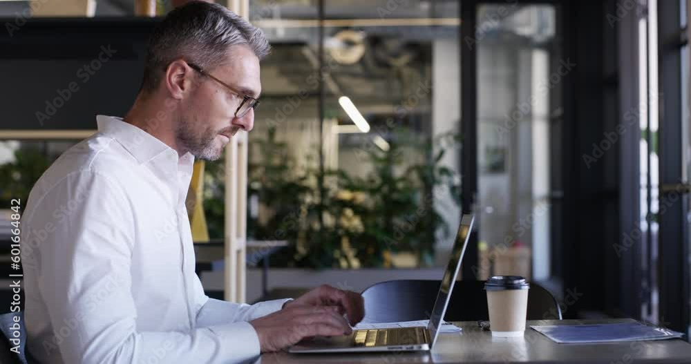 Poster laptop, documents and proposal with a business man working at a desk in his office for report or rev