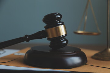 Business and lawyers discussing contract papers with brass scale on desk in office. Law, legal...