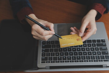 Women holding credit card and using smartphones at home.Online shopping, internet banking, store...