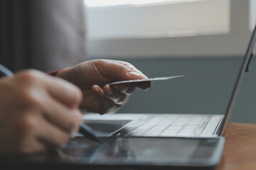 Women holding credit card and using smartphones at home.Online shopping, internet banking, store...