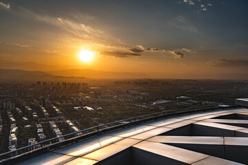 Fototapeta na wymiar High altitude observation deck of the Olympic Tower at sunset in Beijing
