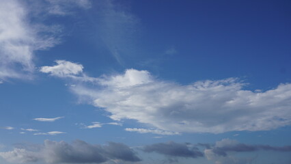 Naklejka na ściany i meble Bright clear blue sky with dense cloud for background, template 