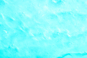 Cosmetic gel, serum transparent sample. Liquid cream with bubble texture. Gel texture of a cosmetic product. Clear liquid lotion for skin care.