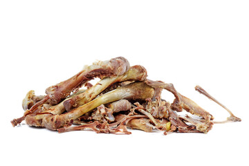Pile of chicken bones isolated on a white background.