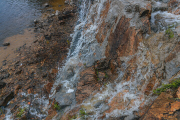 Waterfall Loud threshold on the slope of the Monastery Island in the Dnieper, Ukraine. Artificial decorative waterfall.