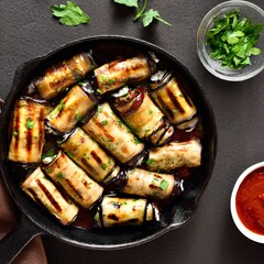Eggplant (aubergine) rolls with cheese and greens