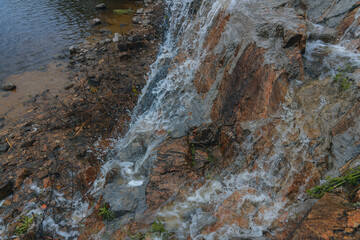 Waterfall Loud threshold on the slope of the Monastery Island in the Dnieper, Ukraine. Artificial decorative waterfall.