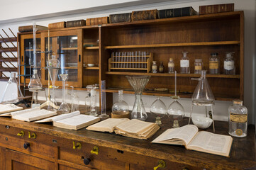 Old chemistry lab with books and test tubes
