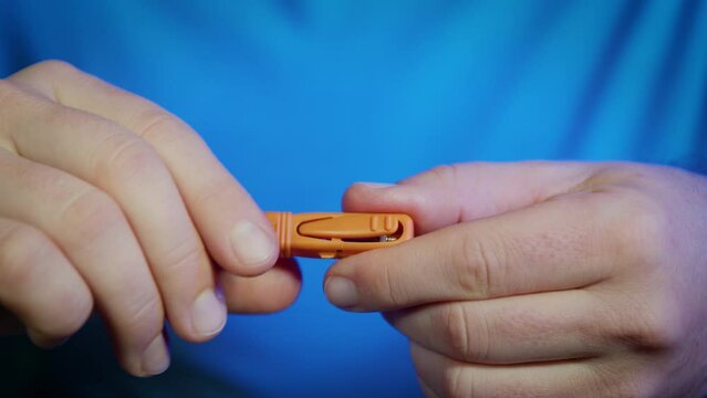 Gently rotate sterile protective cap of medicine device lancet and pull it out