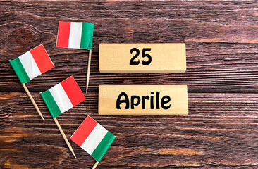 Wooden cubes and miniature Italy flags with the date 25 April .Liberation Day