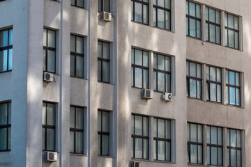 Derzhprom building facade with windows close-up in Kharkiv city center, Ukraine. Office sky-scraper walls details view