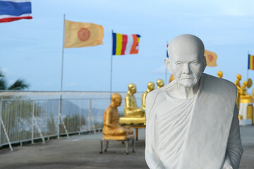 Cultural Landmark of Thailand: Buddha Statues and Flags in Thai Buddhism