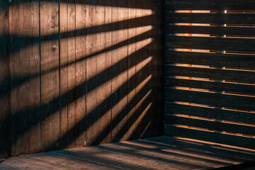 weathered barn wooden background, light passes through cracks, out of focus