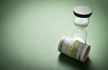 Hourglass and dollar. Time is money