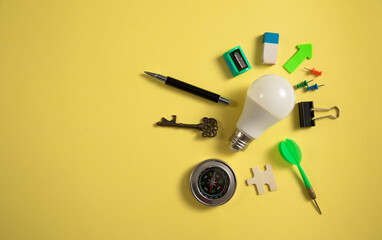 Light bulb with a business supplies. Business. Creative idea