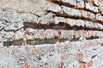 Nahaufnahme von einer alten Backsteinmauer. Verwendbar als Hintergrund oder Textur beispielsweise  für Webseiten 