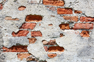 Detailaufnahme von einer alten Backsteinmauer.