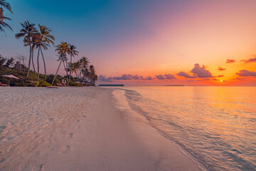 Fantastic closeup view of calm sea water waves with orange sunrise sunset sunlight. Tropical island...