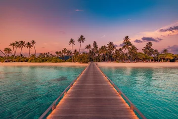 Deurstickers Strand zonsondergang Amazing sunset panorama at Maldives. Luxury resort villas seascape with soft led lights under colorful sky. Beautiful twilight sky and colorful clouds. Beautiful beach background for vacation holiday 