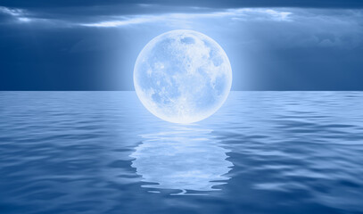 Fantasy landscape - Full Moon on the sea coast with blue sea "Elements of this image furnished by NASA"