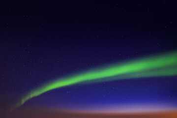 Night blue starry sky and Northern lights. Green aurora borealis