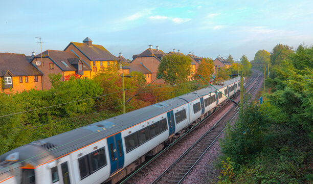 London commuter train in motion -   Located on West Anglia Main Line serving the small town of Sawbridgeworth in Hertfordshire, England
