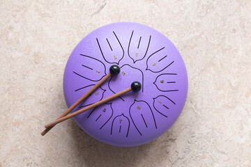 Tongue drum with drumsticks, Purple hang drum. music for relaxation and meditation
