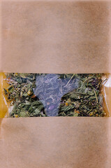 Paper bags with scattered different dried tea