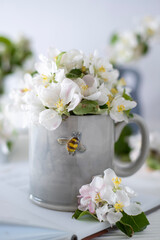 A cup of aromatic coffee and flowers