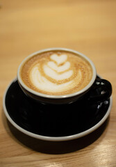 A cup of aromatic coffee on the table
