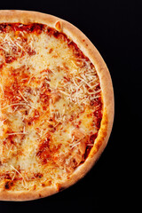 tasty pizza margarita on black background