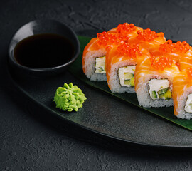 Philadelphia Sushi with avocado on black dish