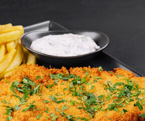 Breaded fried pork chop with french fries