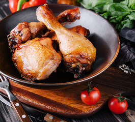 Fried chicken on the plate with tomatoes