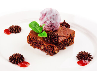 Tasty chocolate brownie with blueberry ice cream
