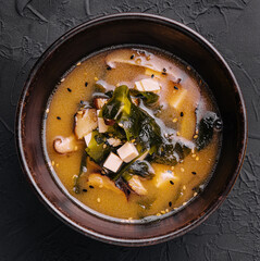 Soup with algae and mushrooms top view
