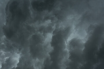 Black rain clouds covered the sky as if there was going to be a heavy rain storm. Gives a dark,...