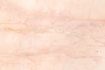 The rose gold marble slab reveals the subtle textures and natural patterns.