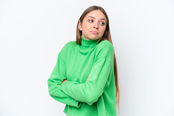 Young beautiful blonde woman isolated on white background making doubts gesture while lifting the shoulders