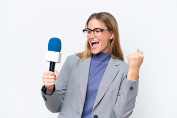 Young TV presenter caucasian woman isolated on white background celebrating a victory