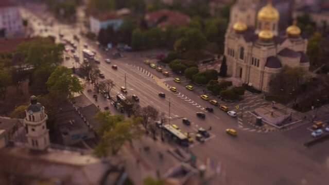 Varna city, Bulgaria aerial panoramic view of the Cathedral and city downtown during sunset. Tilt shift hyperlapse timelapse