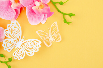The Butterfly Paper Cut with pink color orchid on yellow background