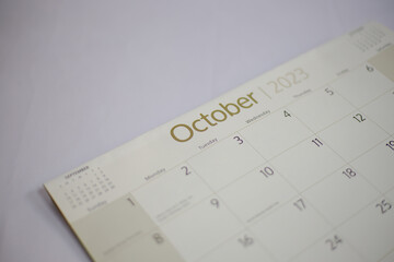 Selective focus shot of a closeup calendar of October 2023. October 2023 calendar isolated on background. 