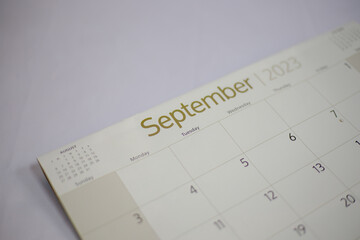 Selective focus shot of a closeup calendar of September 2023. September 2023 calendar isolated on...