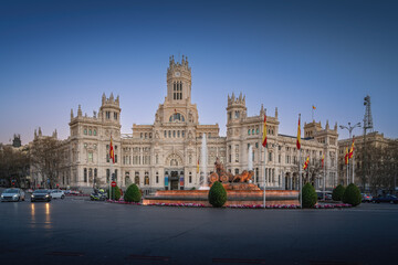 Plaza de Cibeles with Cibeles Palace and Fountain of Cybele at sunset - Madrid, Spain